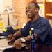 Michigan football star Desmond Howard smiles during an autograph signing at the M Den on Friday.  Melanie Maxwell I AnnArbor.com